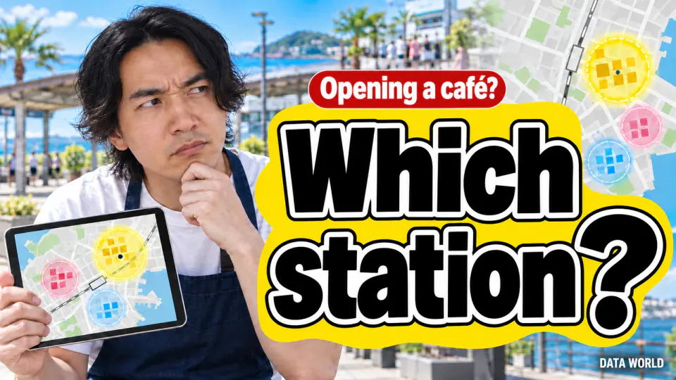 Opening a café? Which station? In a sunny seaside station plaza, DATA WORLD editor-in-chief Kaito Ogasawara, in a navy apron, rests his chin on his hand with a doubtful look, holding a tablet showing a map with three circles. On the right, giant black letters on a yellow band read "Which station?" under a small red tag reading "Opening a café?"
